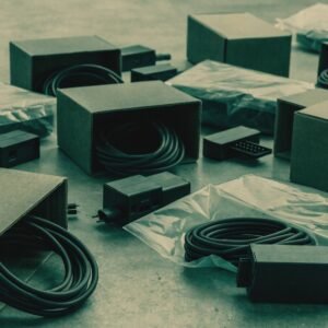 Assorted unbranded consumer electronics accessories and cables in plain packaging